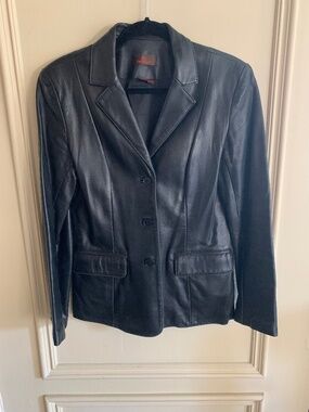 Black leather blazer by Danier. Label says Small, but I think it's more M+